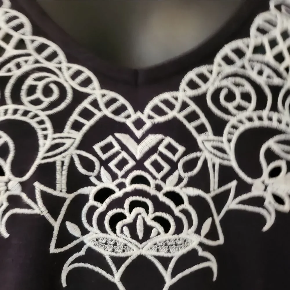 Elegant Black Dress with White Lace Detail